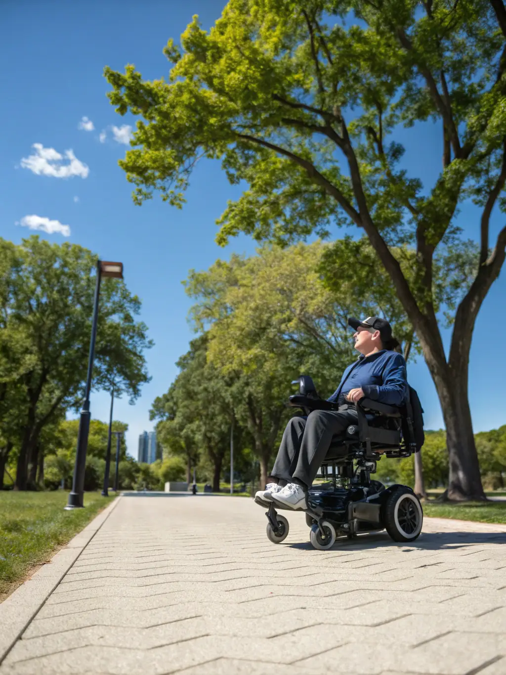 A picture of a person with a disability independently using adaptive equipment during a cycling activity, emphasizing their autonomy and freedom.